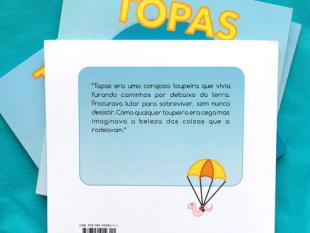 Contracapa do livro Topas onde se pode ler a descrição do mesmo